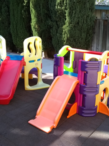 Small plastic slides in outside play area